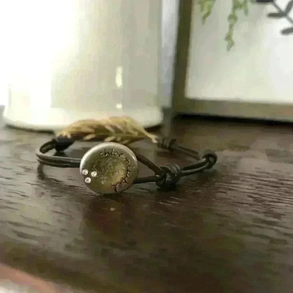 Chloe + Isabel black adjustable cord antique gold plated feather bracelet - Picture 4 of 6